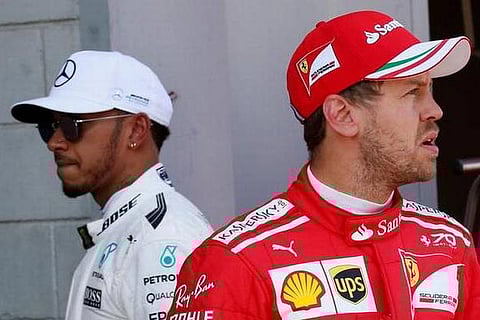 Mercedes F1 driver Lewis Hamilton (L) and Ferrari F1 driver Sebastian Vettel (R)