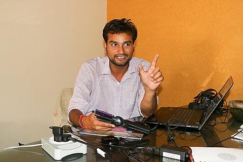 Ansh Mishra with his tripod which the forest officials in Kerala mistook for a gun