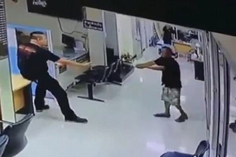 A screengrab of the video shows the assailant handing over the knife