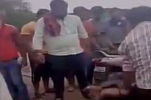 A man in Nagpur being beaten up for allegedly carrying beef  (Photo: ANI)