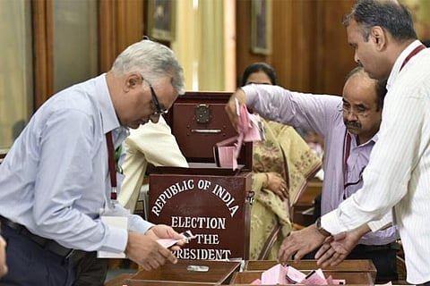 Officials count votes polled in the presidential election