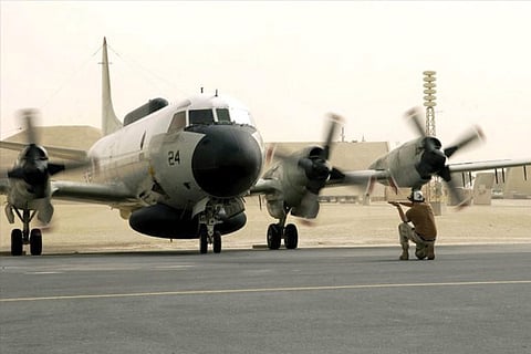 A US Navy EP-3E Aries aircraft is directed by ground crew after a flight from Bahrain