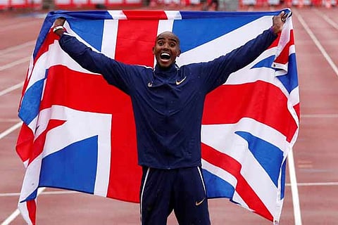 Great Britain's Mohamed Farah celebrates winning the men's 3000m and running his last track race