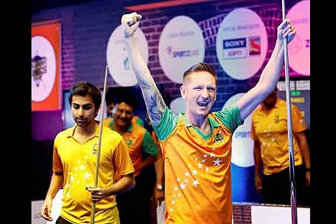 Gujarat Kings? player Andrew Pagett celebrates after beating Chennai Strikers' Pankaj Advani