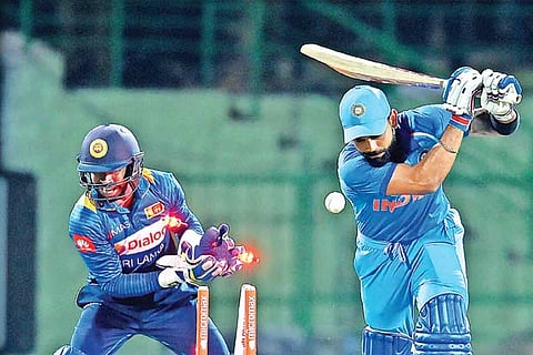 Indian captain Virat Kohli is bowled by spinner Akila Dananjaya during the second ODI