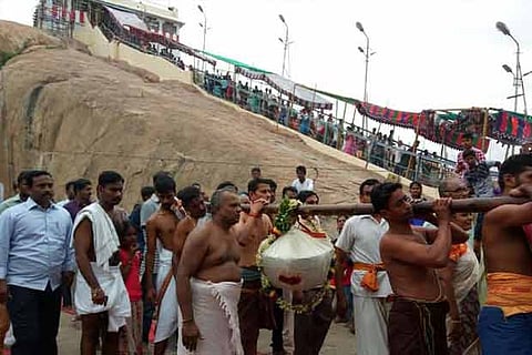 Representative image of temple staff 