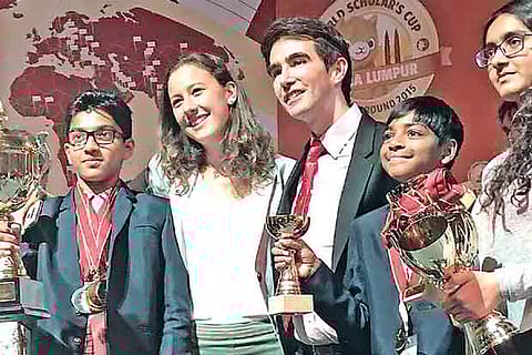 The winning students pose with their trophies