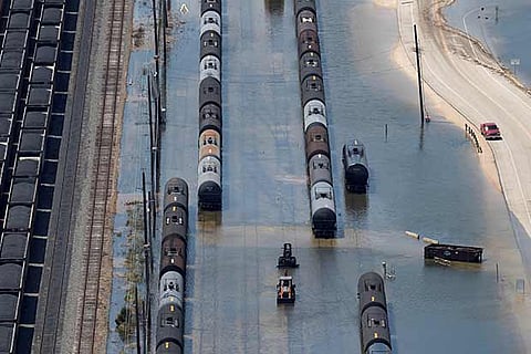 Rain cars and tracks are submerged in flood waters caused by Tropical Storm Harvey