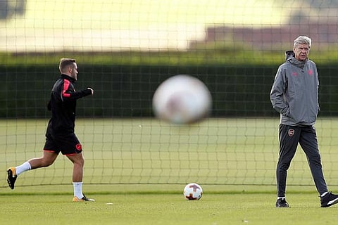 Arsenal manager Arsene Wenger and Jack Wilshere during training