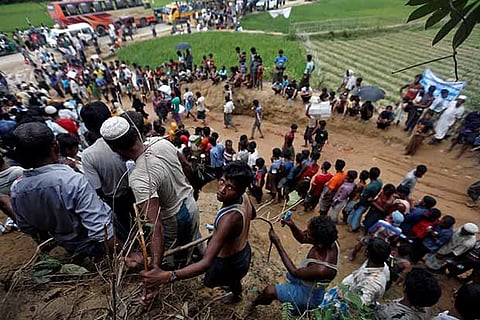 Rohingya refugees queue for aid in Cox's Bazar, Bangladesh
