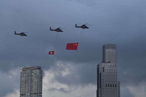 Helicopters towing the flags of China