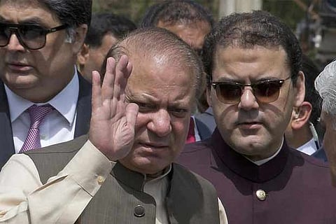 Pakistan's ousted Prime Minister Nawaz Sharif with his son Hussain Nawaz (right)