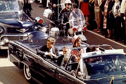 Jaqueline Kennedy and Governor John Connally in a limousine moments before Kennedy was assassinated