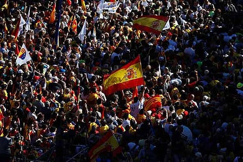 Pro-unity supporters take part in a demonstration in central Barcelona, Spain