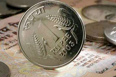 Rupee spurts 12 paise against dollar to 64.63