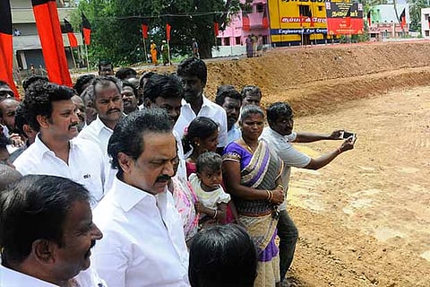Opposition leader MK Stalin inspects a water body, desilted by DMK cadre, in Guntoor (Tiruchy)