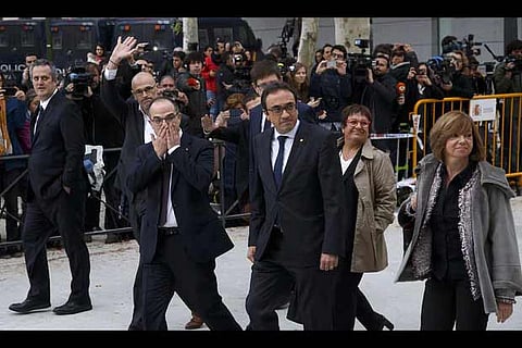 Former members of the Catalan government arrive at Spain?s national court in Madrid