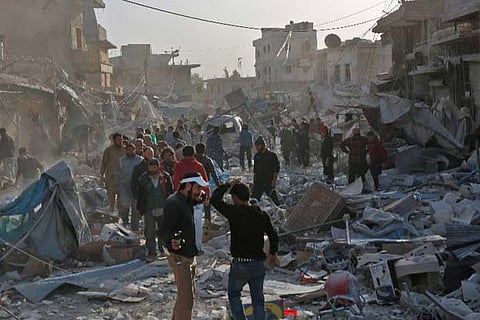 Aftermath of air strikes on a marketplace in Atareb in Syria (Image credit: AFP)