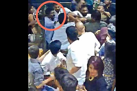 Karunas (in circle) at a popular bar in Chennai