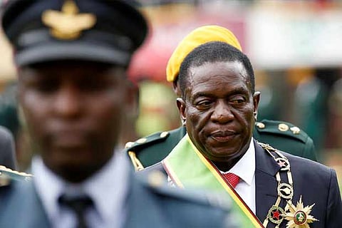 Emmerson Mnangagwa walks after he was sworn in as Zimbabwe's president in Harare
