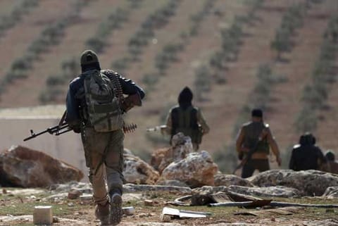 Reuters file photo of Syrian rebel fighters on the outskirts of the city