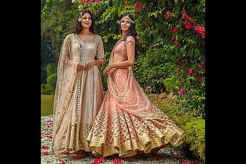 Models posing wearing designer Abhinav Mishra creations (Image: Facebook)