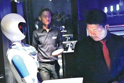 A robot presenting the menu to a customer at the restaurant