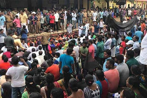 Fishermen staging a rail roko at Kuzhithurai station on Thursday