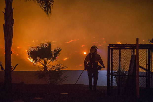 Weather eases the battle as California wildfires grow