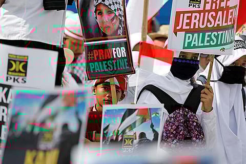 Protesters hold a rally outside the US embassy in Jakarta, Indonesia