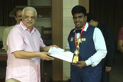 S Shrikrishna receiving the gold medal from the chief guest in Bengaluru