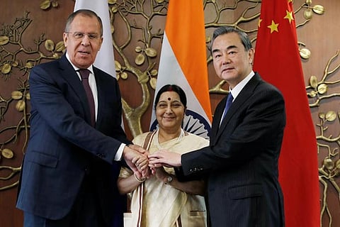 Russian FM Sergei Lavrov (L) Indian FM Sushma Swaraj (C) and Chinese FM Wang Yi