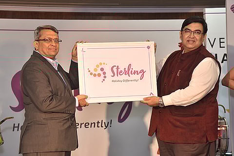 Ramesh Ramanathan (L) with Peshwar Acharya, CMO, unveiling the new logo