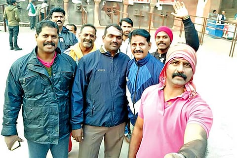 The police team from Tamil Nadu posed for a selfie before setting off on the manhunt