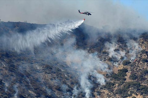 File photo of firefighters trying to contain the Thomas fir, a wildfire in California