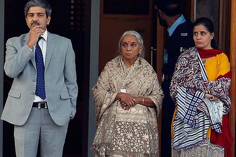 Wife (R) and mother (C) of Kulbhushan Jadhav escorted by an Indian diplomat after the meeting