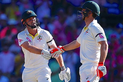 Australia's Mitchell Marsh and Shaun Marsh shake hands during the third day of the fifth Ashes Test
