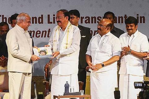 VP Naidu presents a souvenir to Governor Purohit. Min D Jayakumar and Vijaya Baskar are also seen