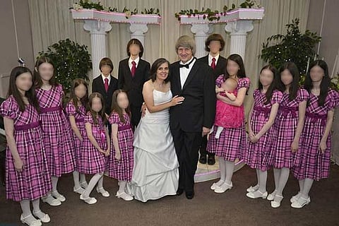 David and Louise Turpin, with their children