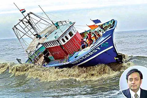 A boat capsizes as fishermen try to find balance (Insert: Shashi Tharoor)
