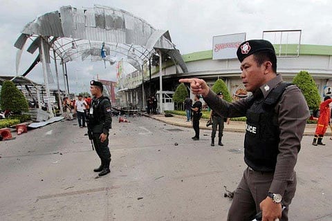 Security forces seen at the site of a bomb attack in Thailand