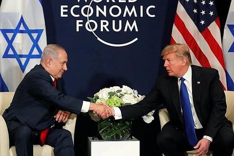 US President Donald Trump shakes hands with Israeli PM Benjamin Netanyahu