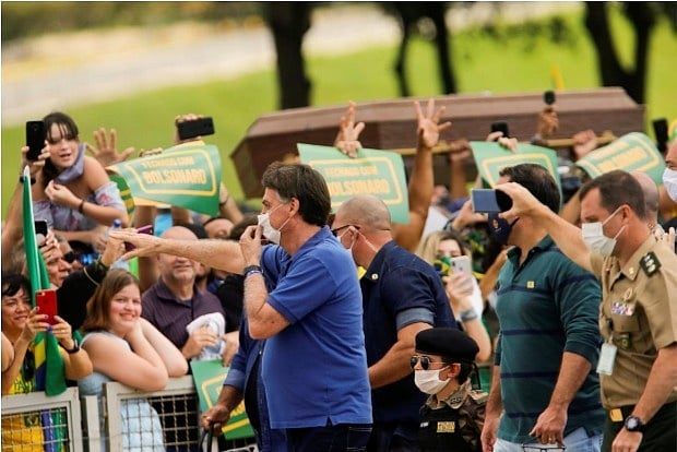 Bolsonaro fined as he flouts mask rule before motorcyclists