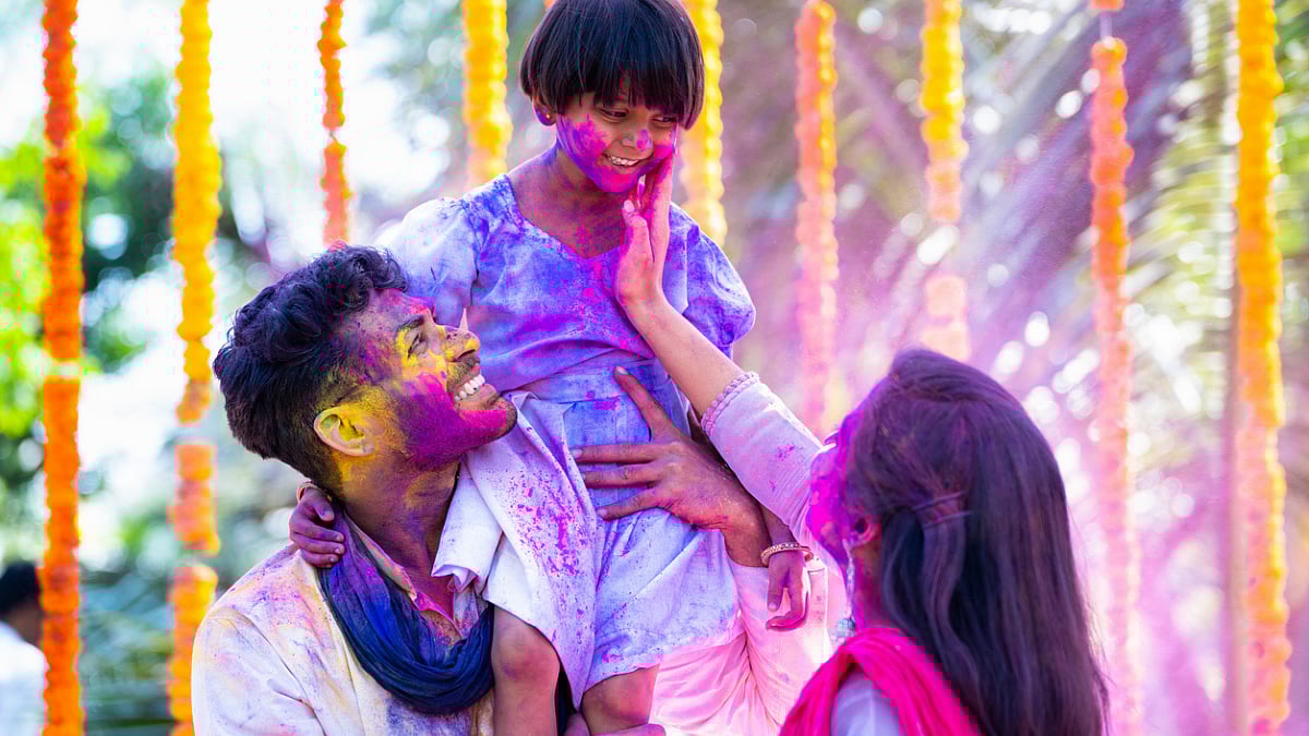 family playing holi
