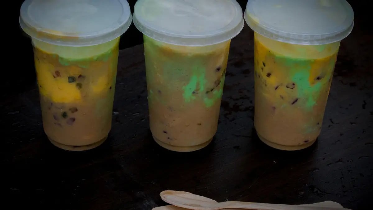 three iice cream box with spoon 