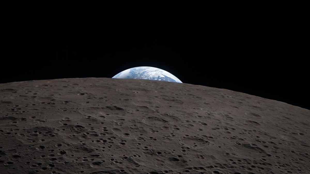Earth sets behind the Moon during a lunar flyby