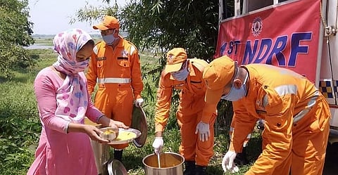 NDRF 1st Battalion distributes food among people needy in Guwahati