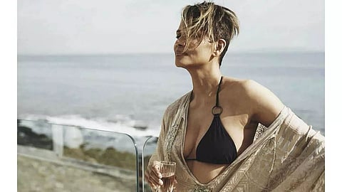 Actress Halle Berry bares all while drinking wine