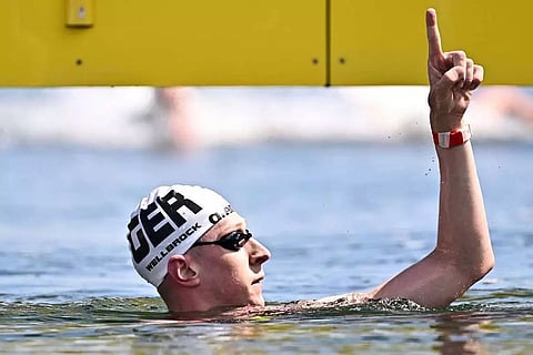 Germany’s Florian Wellbrock wins men’s 10km title at swimming