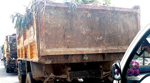 Garbage carriers leave  trails of spillage behind!